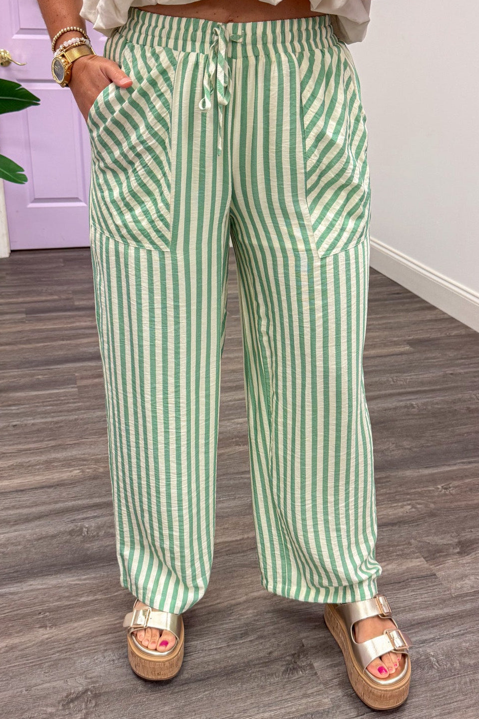 sage green and cream striped lightweight fabric wide leg pants with front pockets