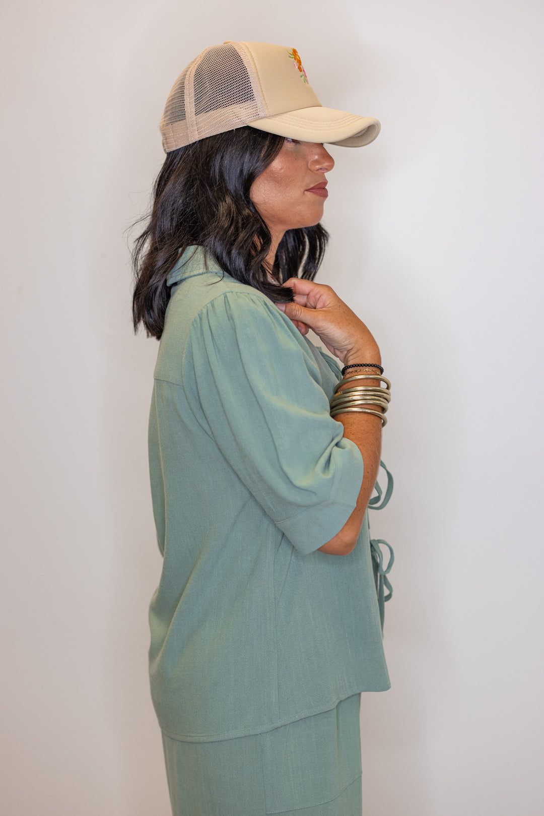 Women's sage green linen bow tie top and elastic waist wide leg pants set by Jodifl showing up close side view of top
