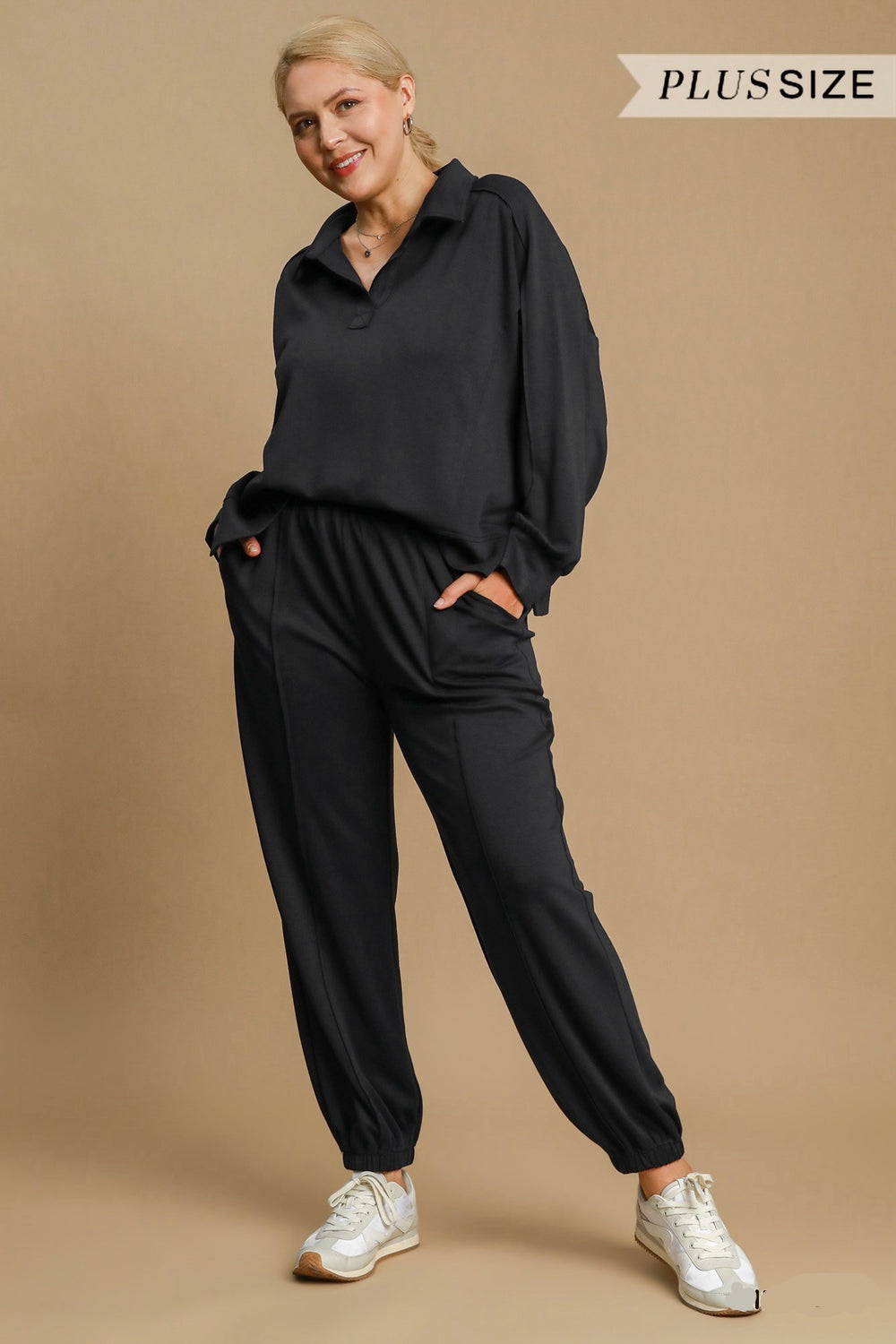 Women's black scuba luxe knit jogger pants with raw/reverse seam details by Umgee in plus size showing front view
