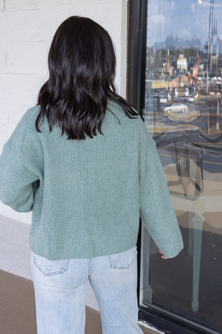 Women's pistachio green ribbed knit sweater by Wishlist showing up close back view