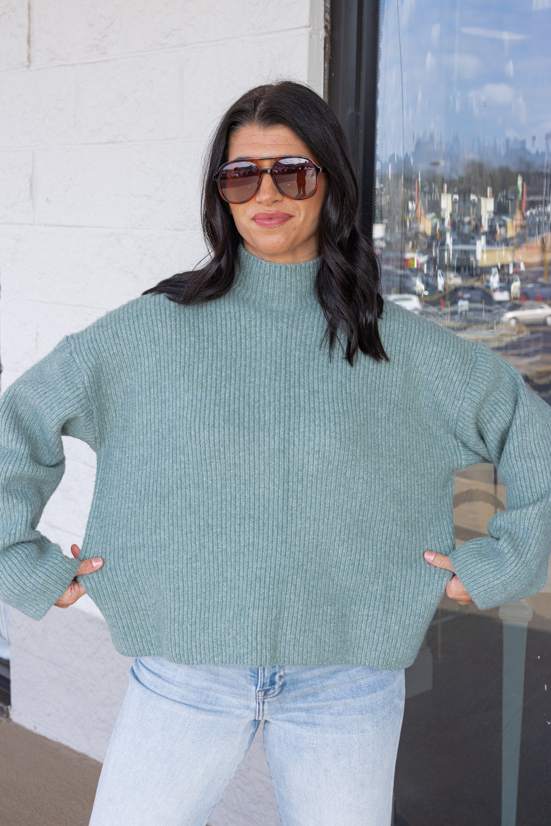 Women's pistachio green ribbed knit sweater by Wishlist showing true to size fit