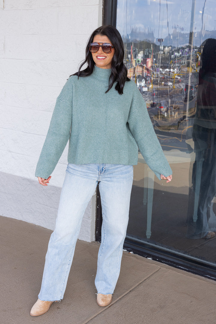 Women's pistachio green ribbed knit sweater by Wishlist showing full front view