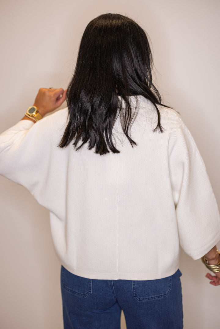 Women's collared off white ribbed knit top by Entro 