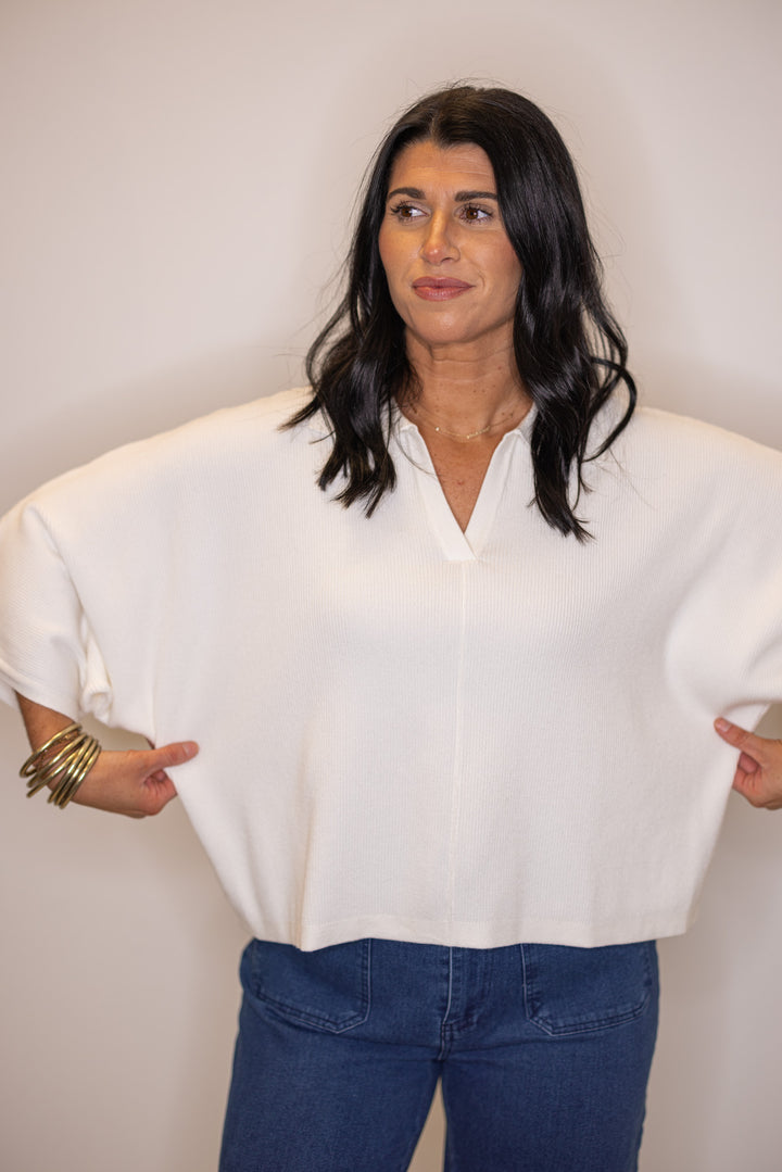 Women's boxy off white ribbed knit top with a collar by Entro