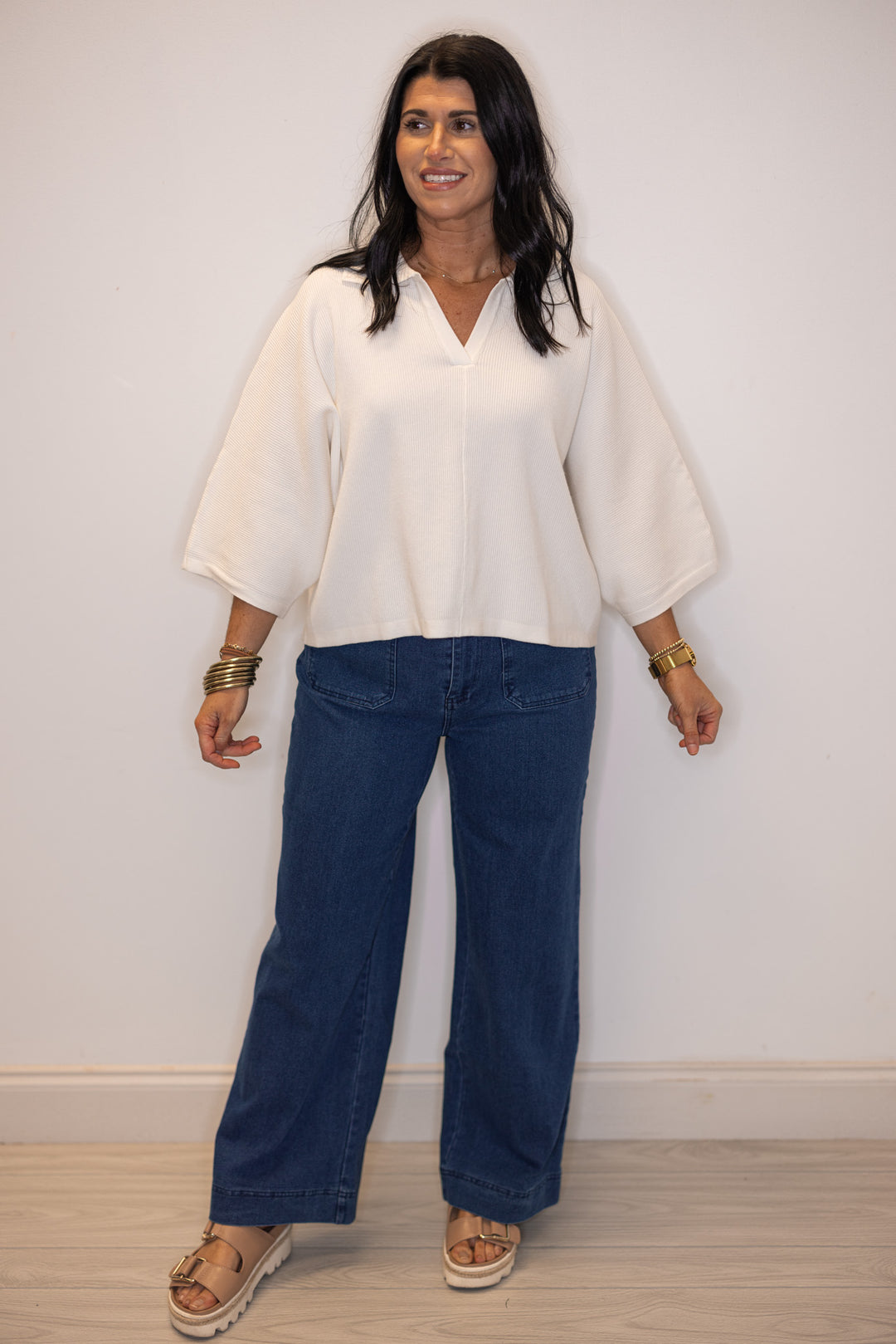 Women's off white ribbed knit top with a collar by Entro, perfect for dressier outfits
