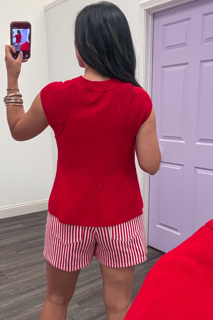 red cap sleeve relaxed silhouette knit top with reverse seam details