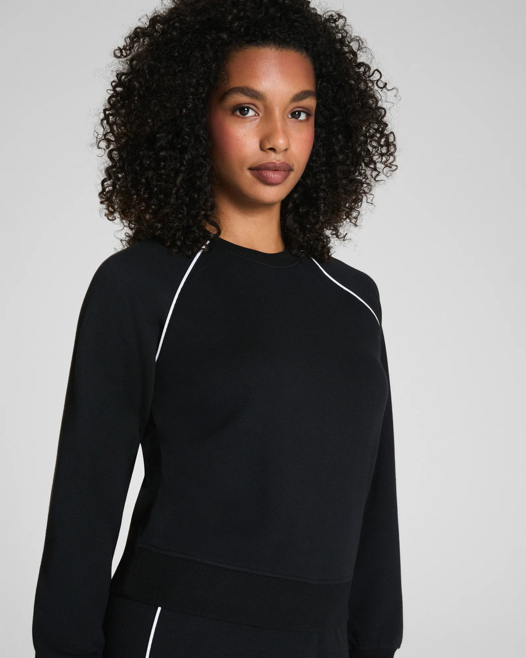spanx airessentials black pique crewneck top close