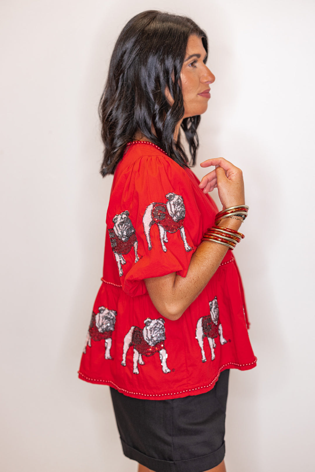 Women's red peplum top with sequin UGA Bulldogs and red pearl trim by Stewart Simmons showing up close side view