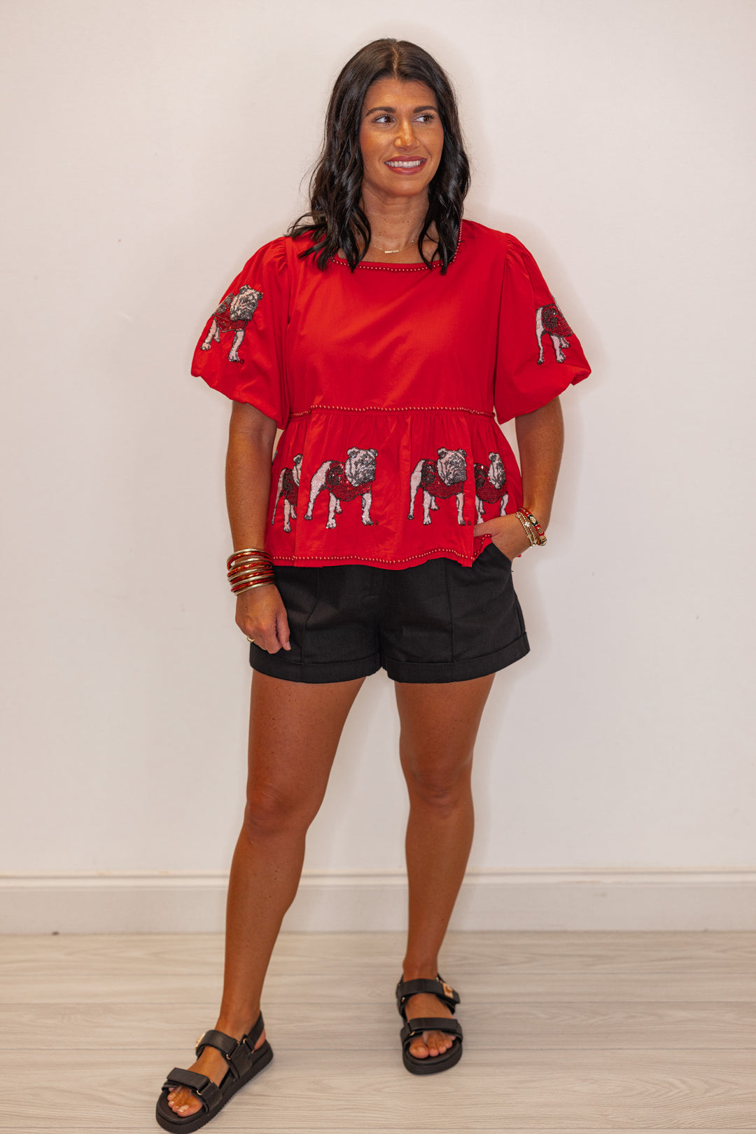 Women's red peplum top with sequin UGA Bulldogs and red pearl trim by Stewart Simmons showing full front view
