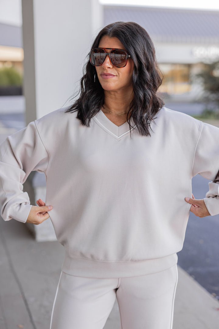 Women's mocha and cream scuba knit top by Rae Mode showing true to size fit