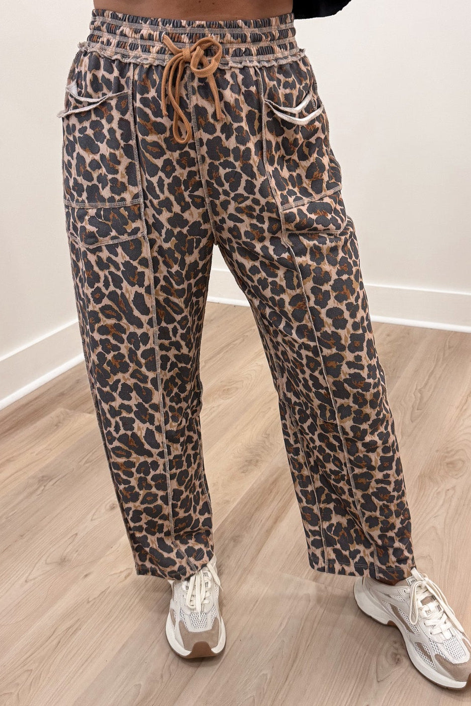 taupe black and brown leopard print french terry knit barrel leg pants with reverse seam details