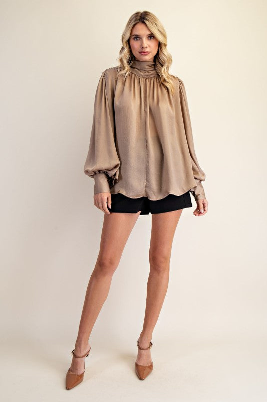 Women's taupe shimmering satin mock neck top with bow tie back showing ful front view
