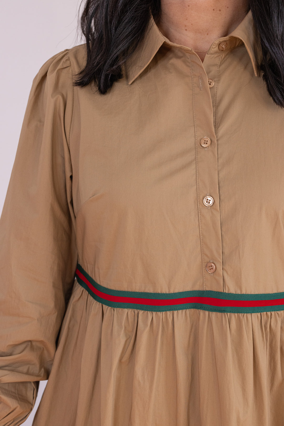 Women's taupe poplin midi dress with red and green ribbon trimmed tiers by Jodifl showing up close, bodice view