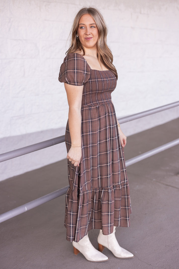 Women's brown plaid midi dress with smocked bodice by Blu Pepper showing full side view