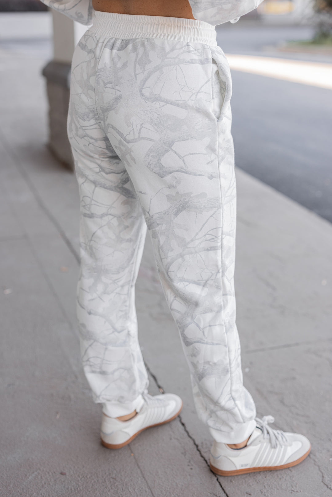 Women's grey snow camo joggers by BucketList showing slight back view
