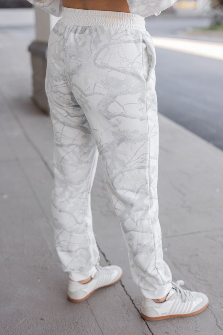 Women's grey snow camo joggers by BucketList showing slight back view