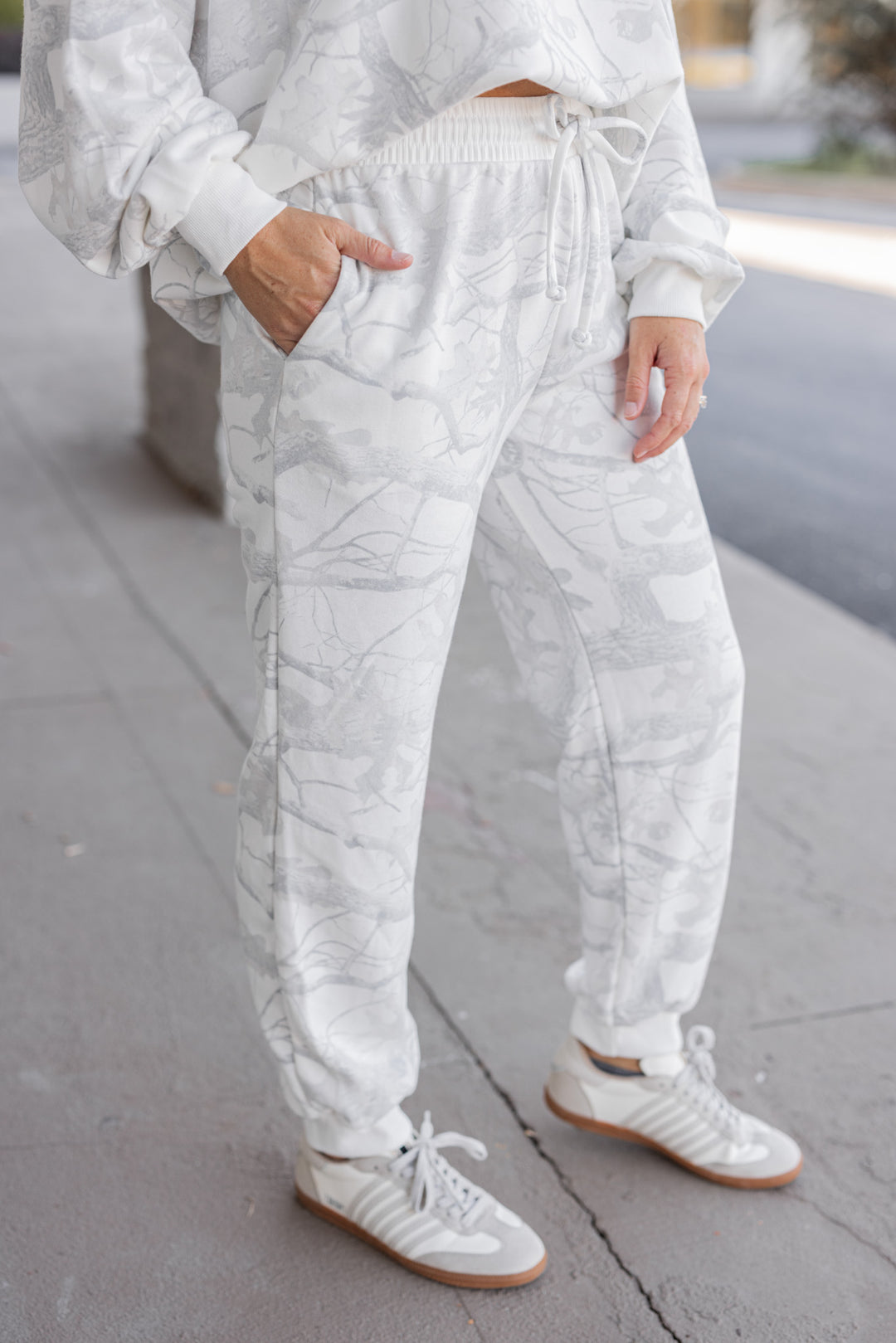 Women's grey snow camo joggers by BucketList showing up close side view