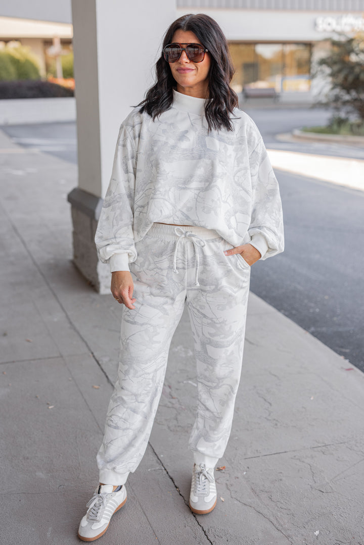 Women's grey snow camo joggers by BucketList showing full front view