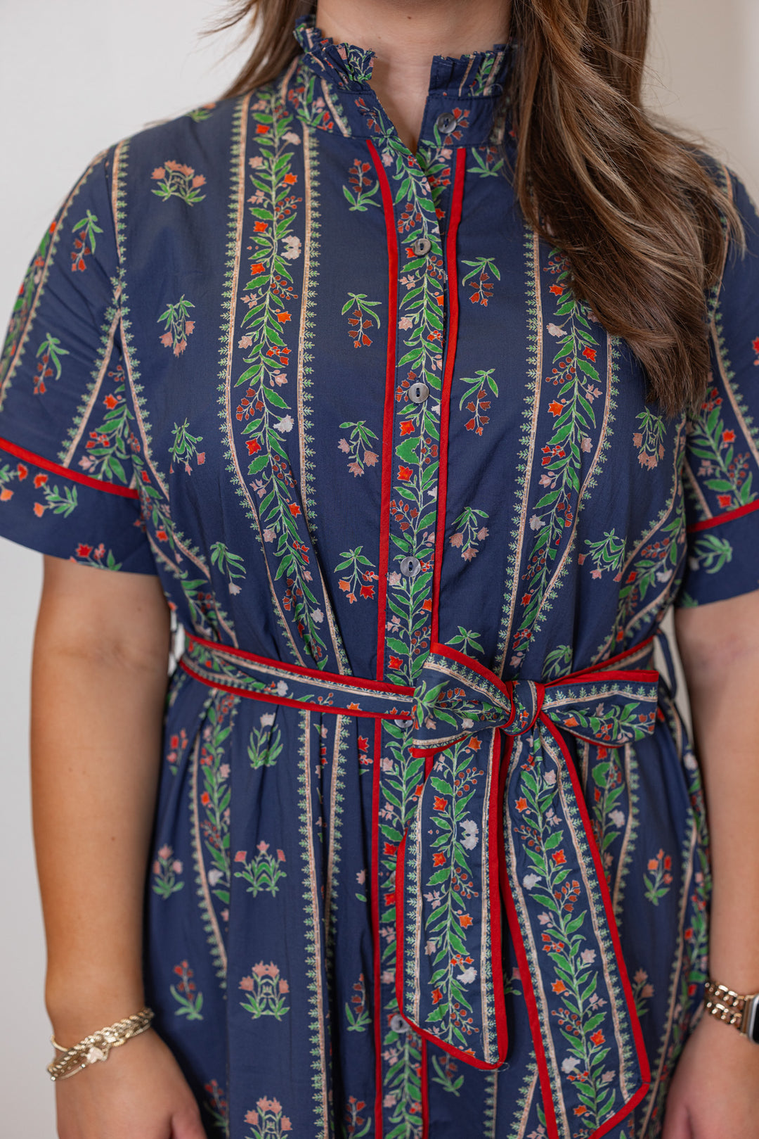 Women's navy blue button front midi dress with floral trellis print and red trim by Entro showing up close front view