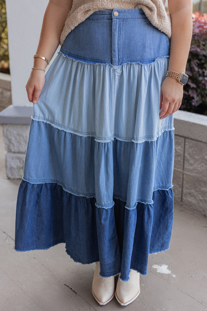 Women's ruffle tiered denim maxi skirt in multi shades of blue showing up close front view