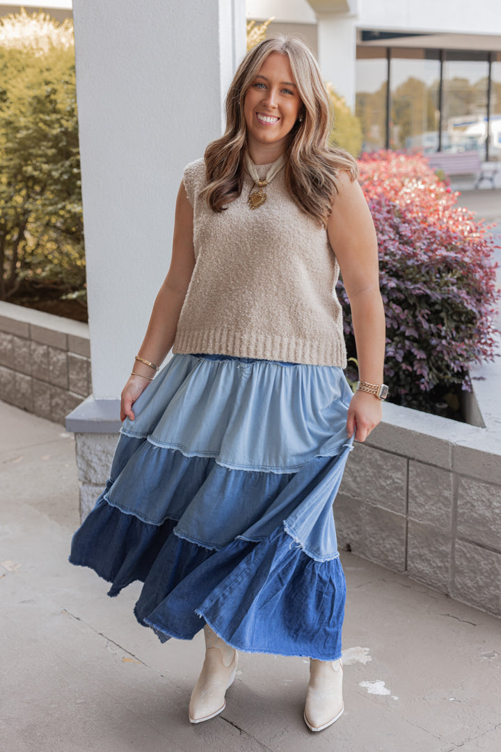 Women's ruffle tiered denim maxi skirt in multi shades of blue, perfect for fall date nights