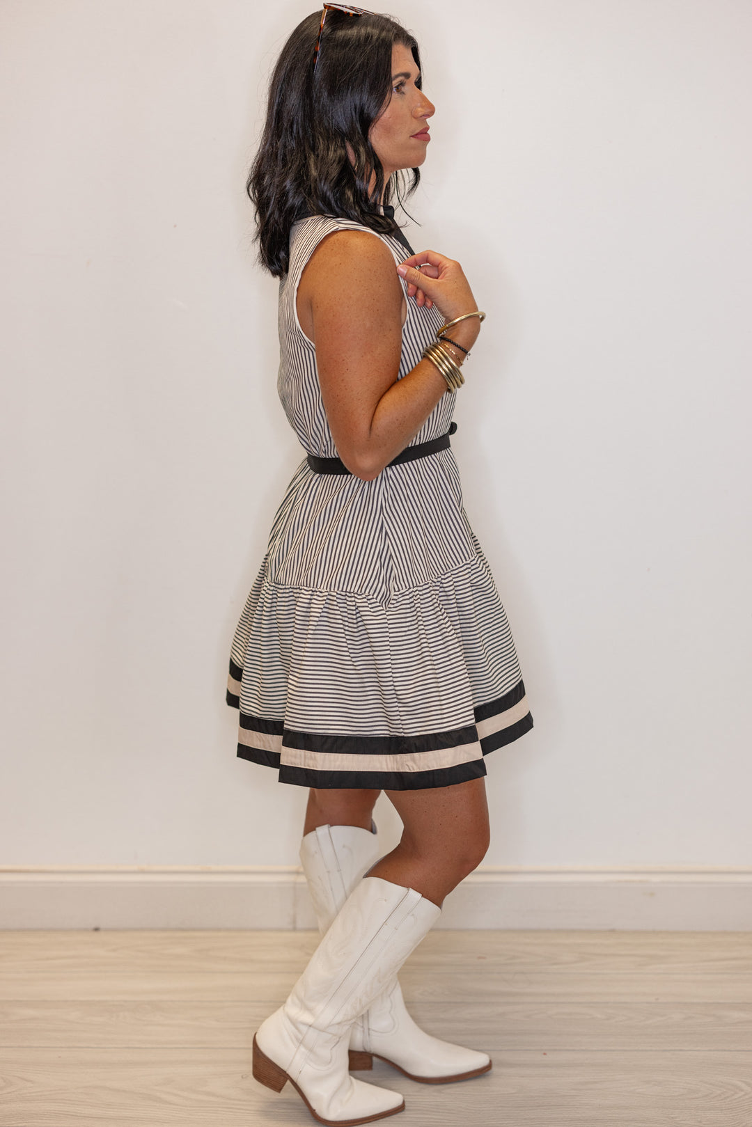 Womens black and cream striped button front dress with belted waist by Entro showing full side view