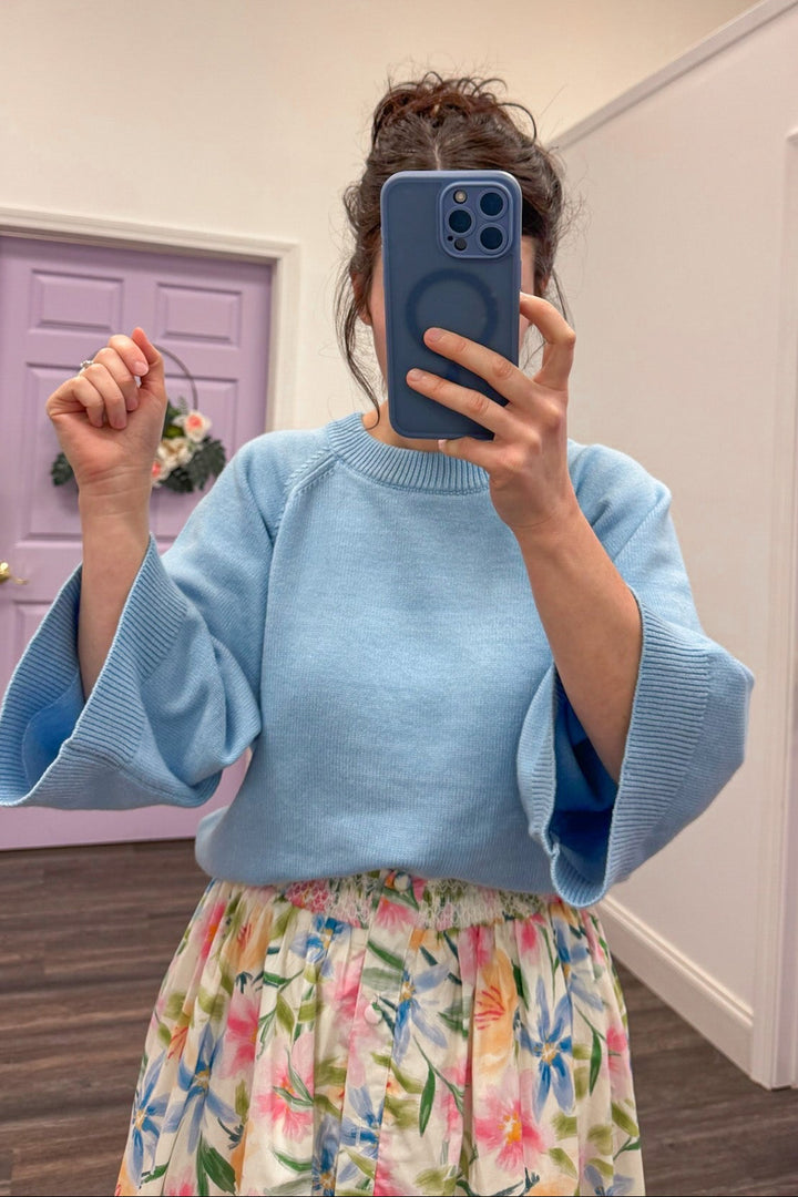 Women's light blue sweater with accent stitching details by Entro, great for the office