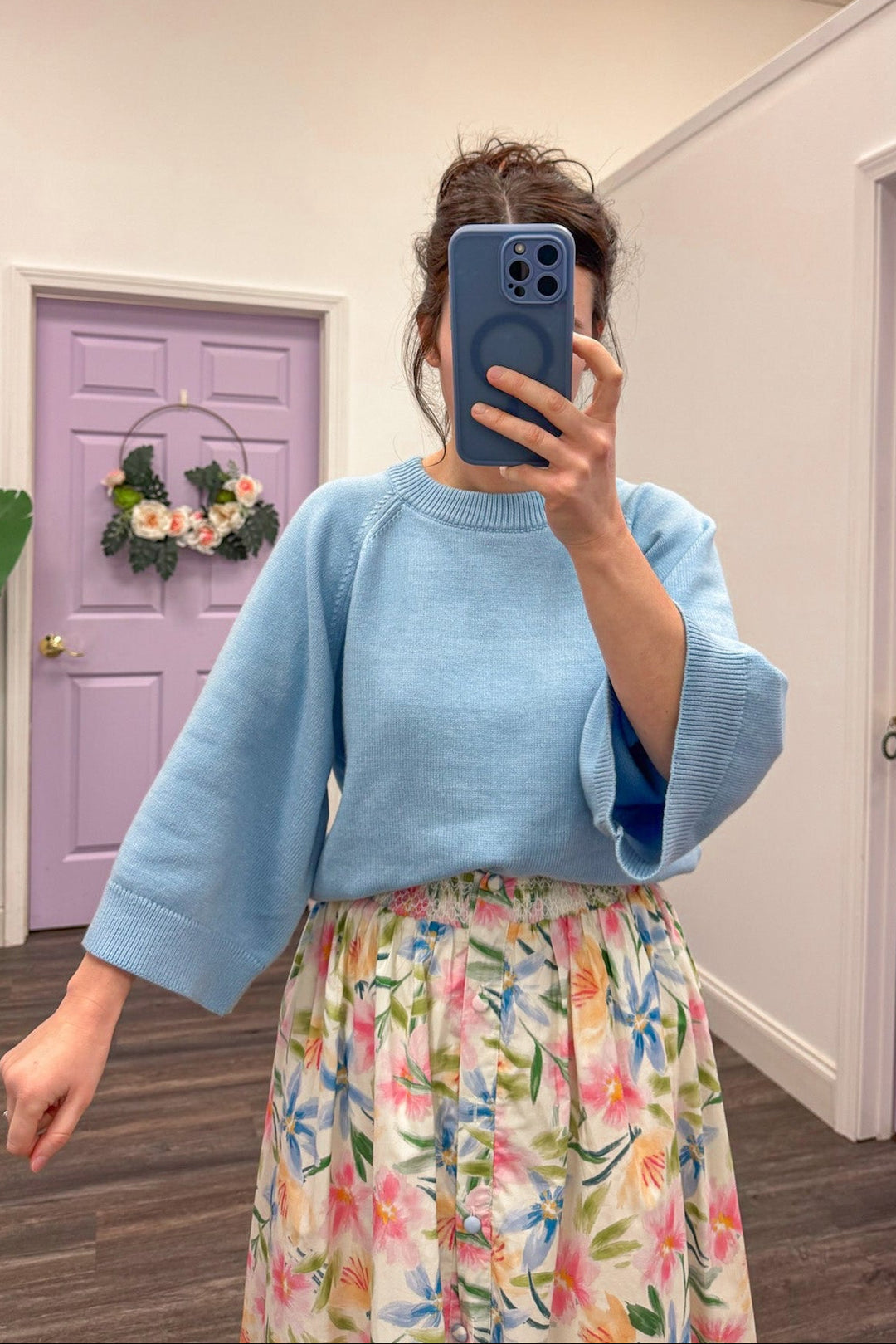 Women's light blue sweater with accent stitching details by Entro