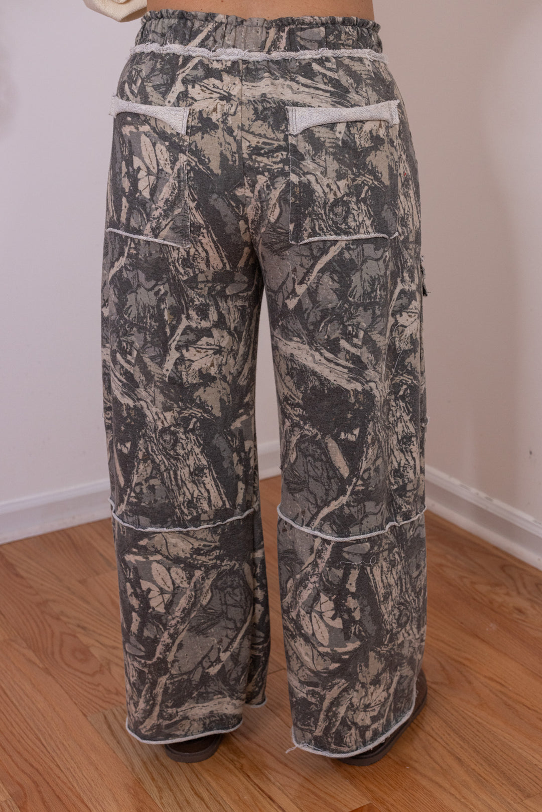 Women's washed hunter green terry knit wide leg cargo pants in tree camo print by J. Her showing up close back view