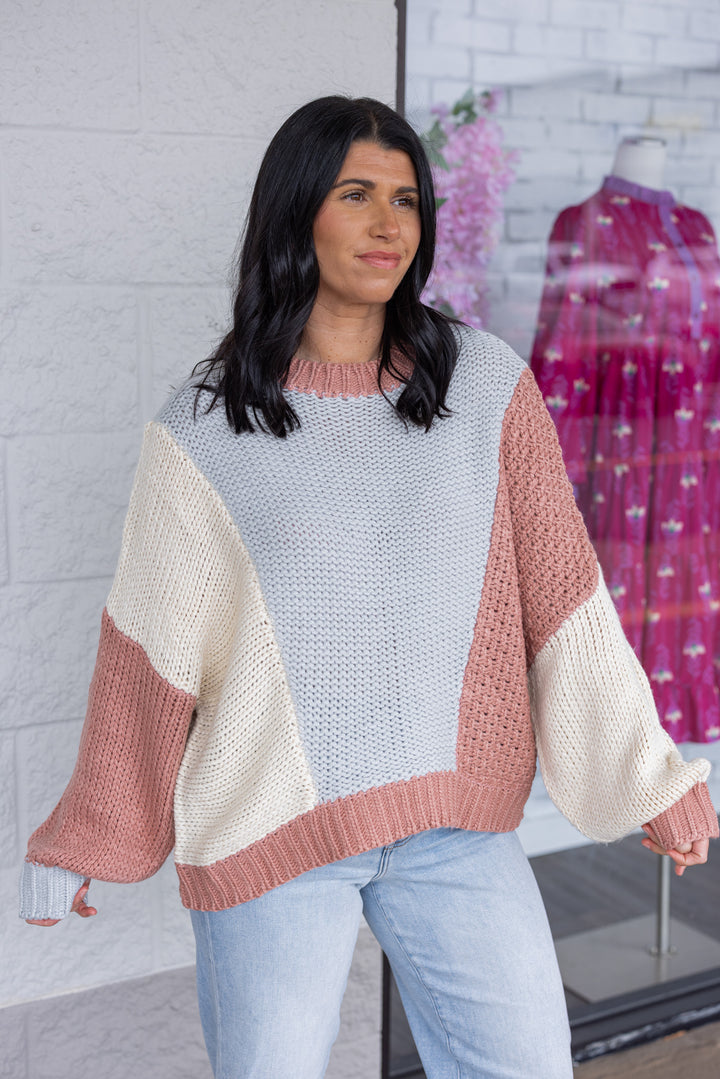 Women's dusty rose and light blue knit colorblock sweater by Wishlist showing up close slight side view