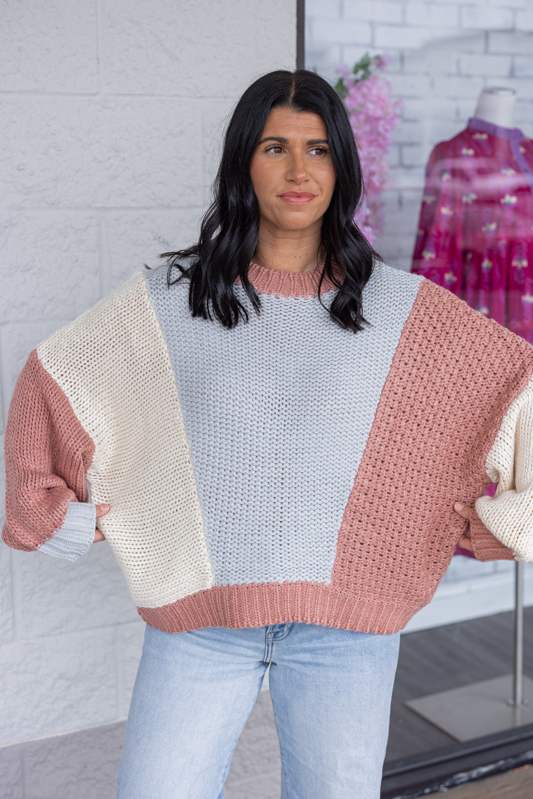 Women's dusty rose and light blue knit colorblock sweater by Wishlist showing true to size fit