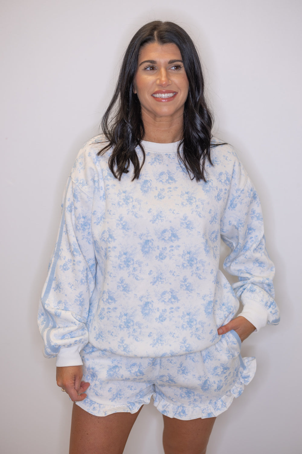 Women's cozy cream french terry knit pullover sweatshirt with light blue floral print