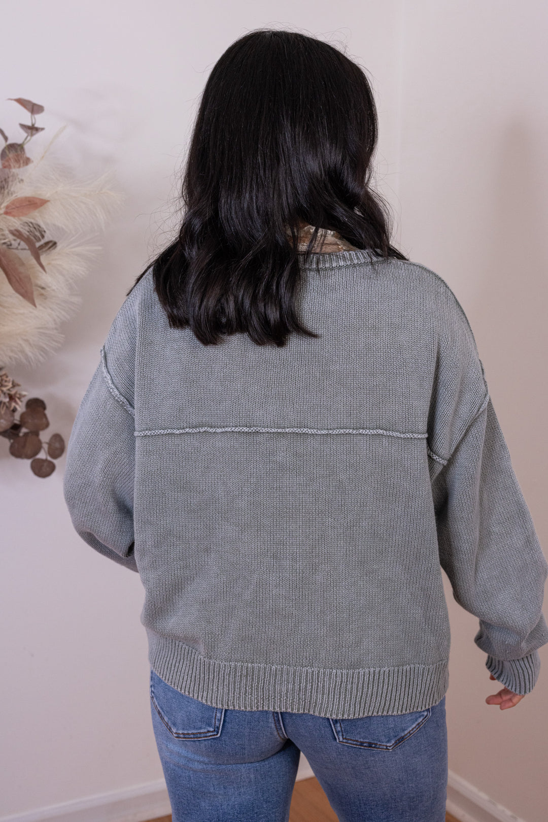Women's washed olive green button front sweater knit cardigan showing up close back view