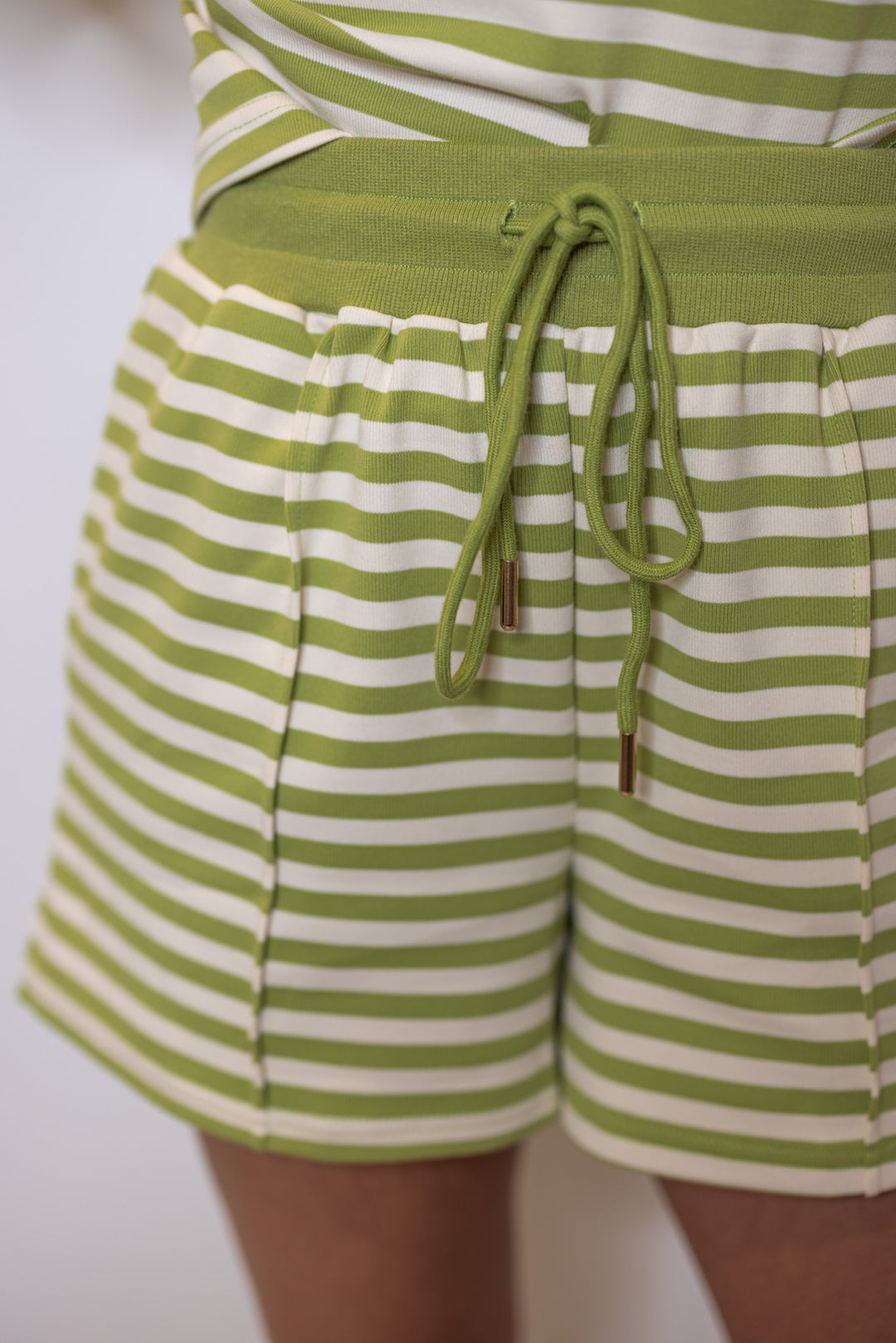 Women's ribbed knit shorts in matcha green and cream stripes by Entro