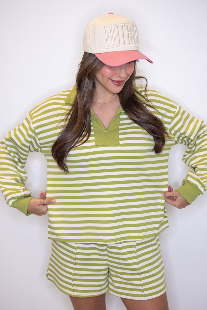 Women's ribbed knit top in matcha green and cream stripes by Entro showing true to size fit