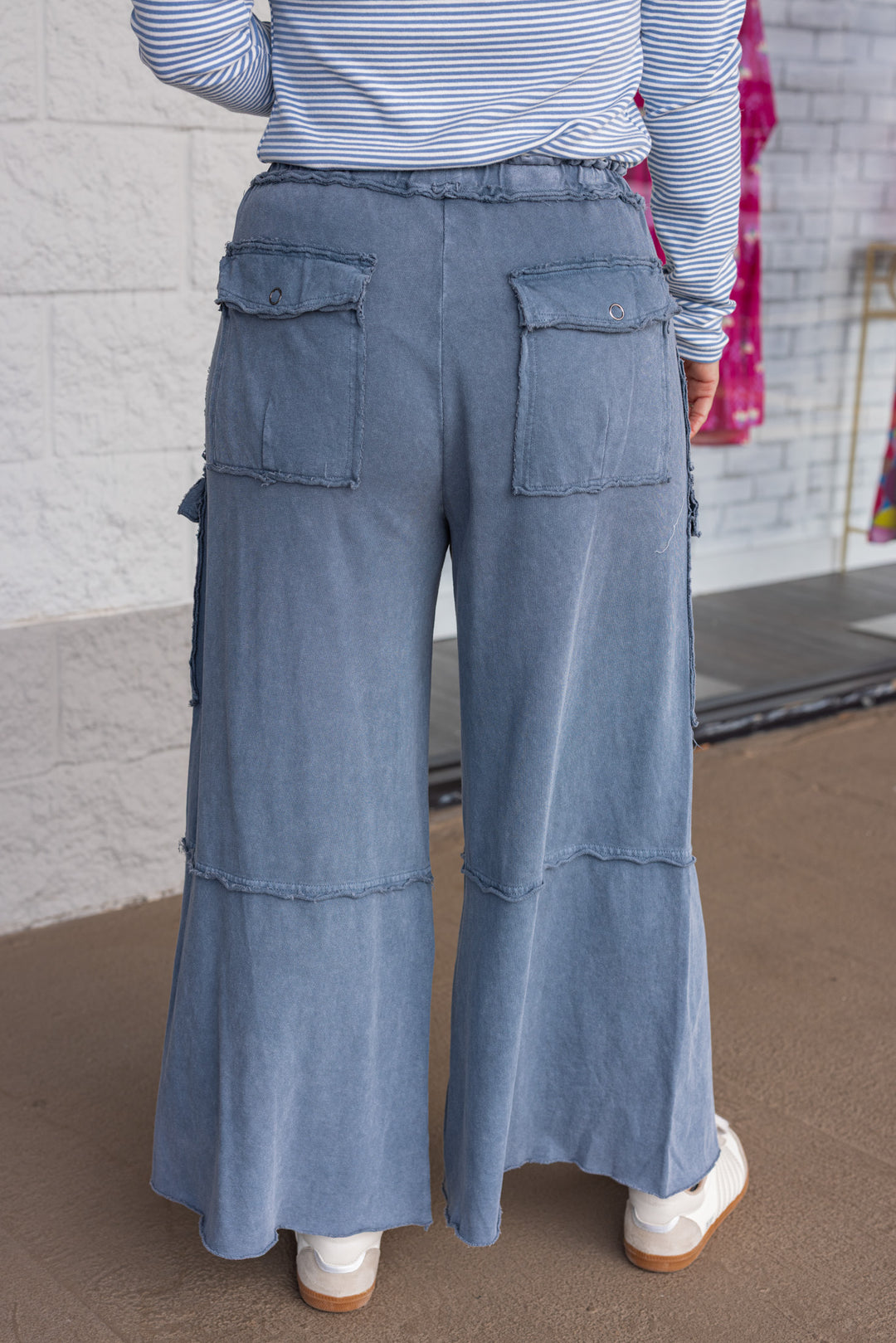 Mineral washed faded navy blue terry knit cargo pants by Easel showing up close back view