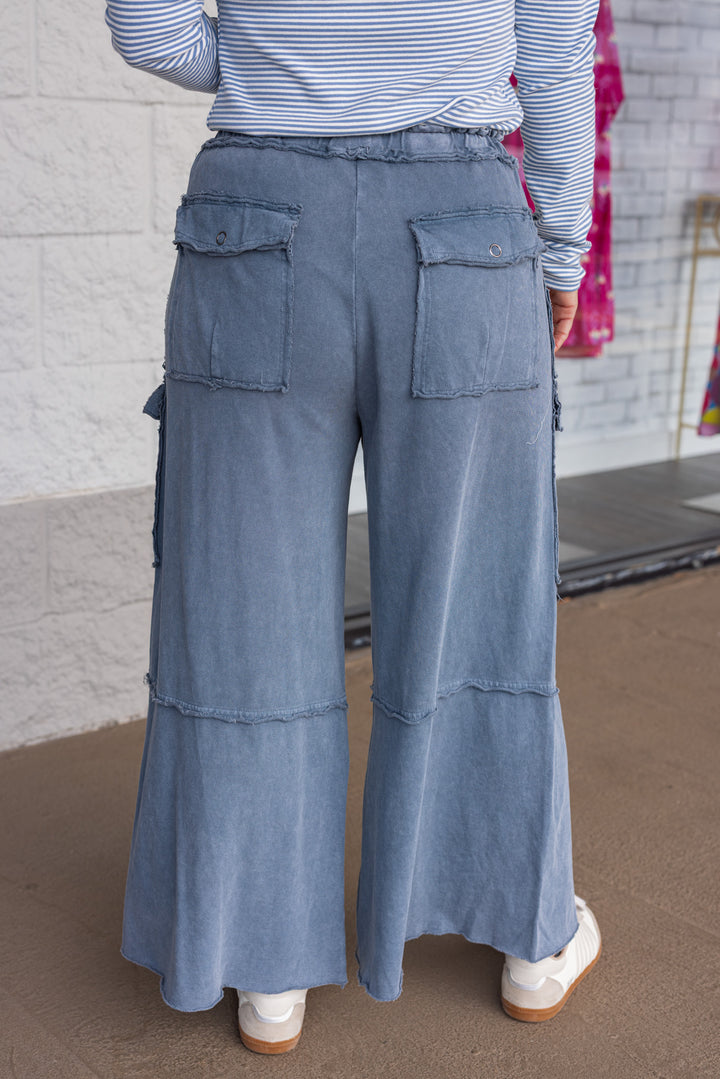 Mineral washed faded navy blue terry knit cargo pants by Easel showing up close back view