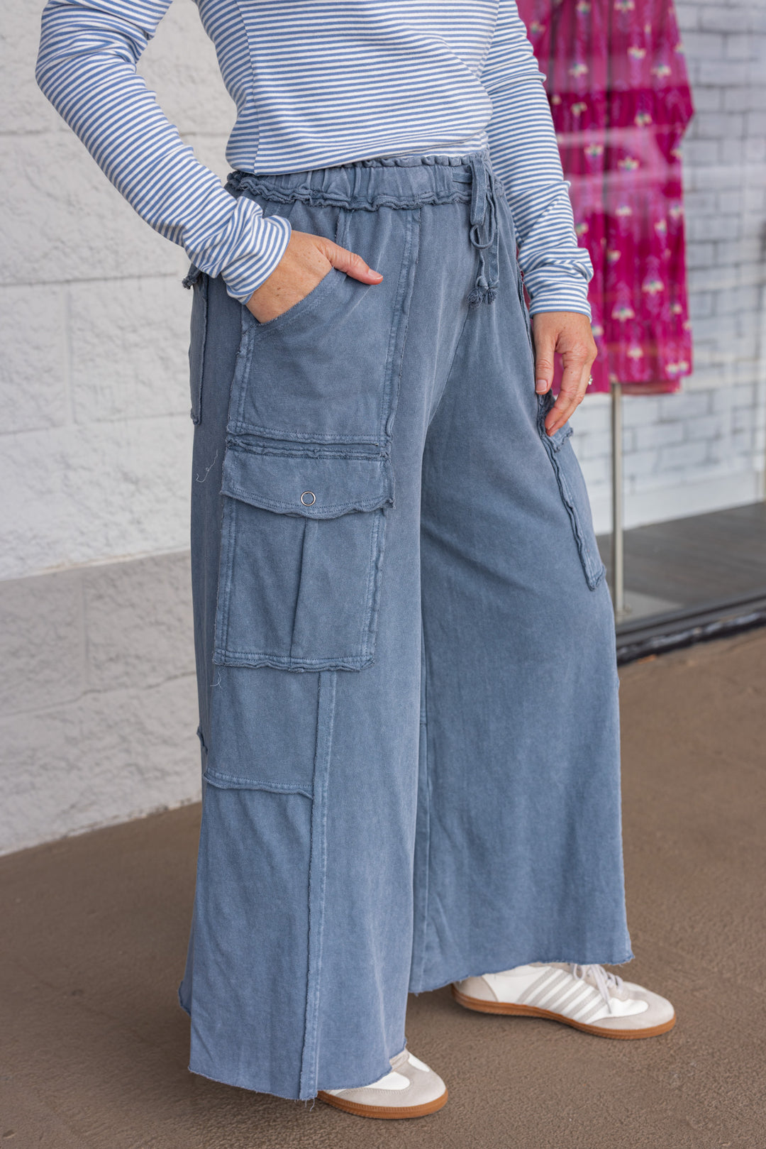 Mineral washed faded navy blue terry knit cargo pants by Easel showing up close side view