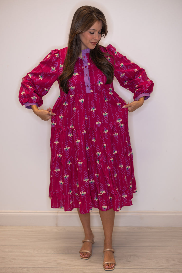 Women's magenta pink floral print tiered midi dress with button front bodice by Jodifl showing true to size fit