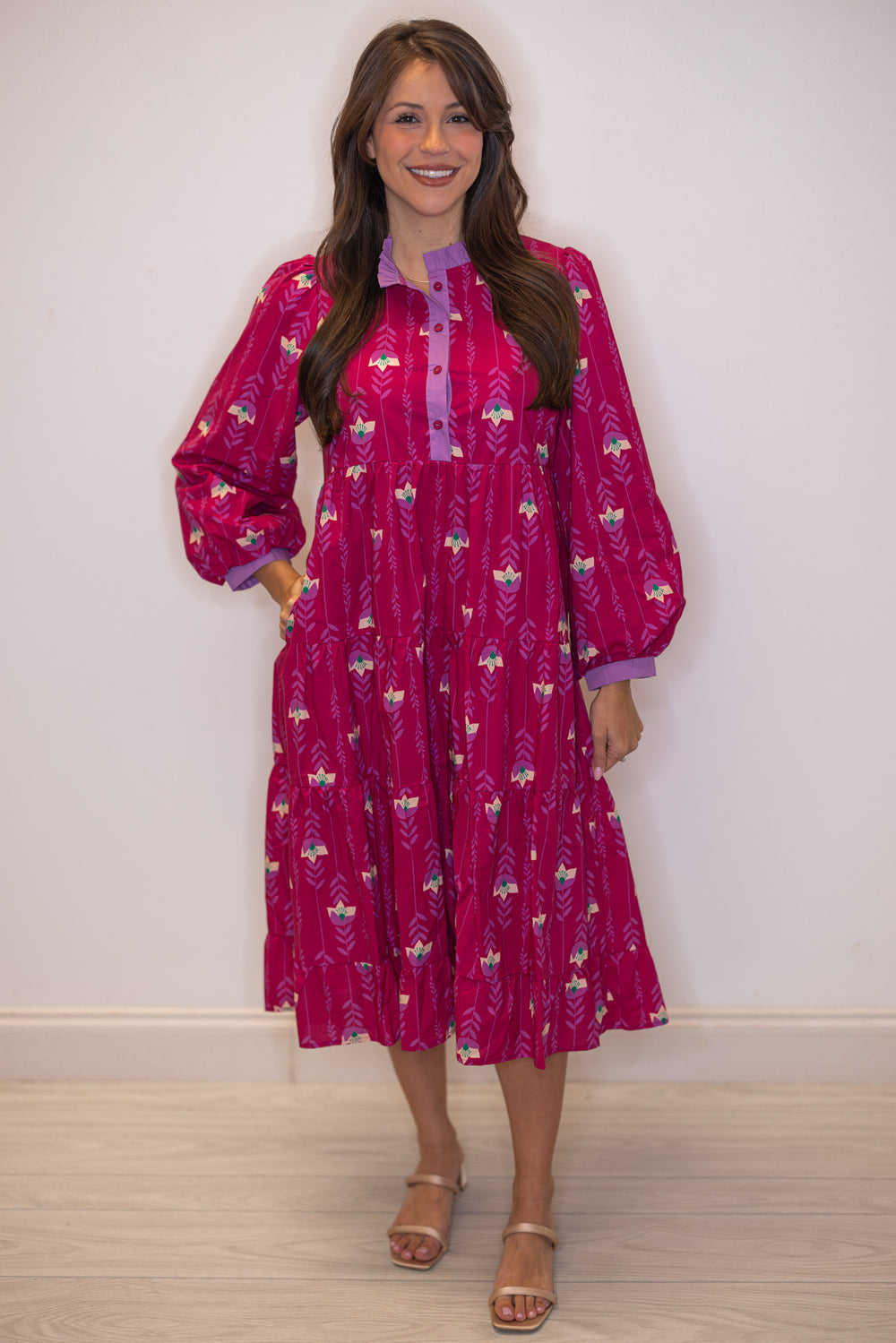 Women's magenta pink floral print tiered midi dress with button front bodice by Jodifl showing side pockets