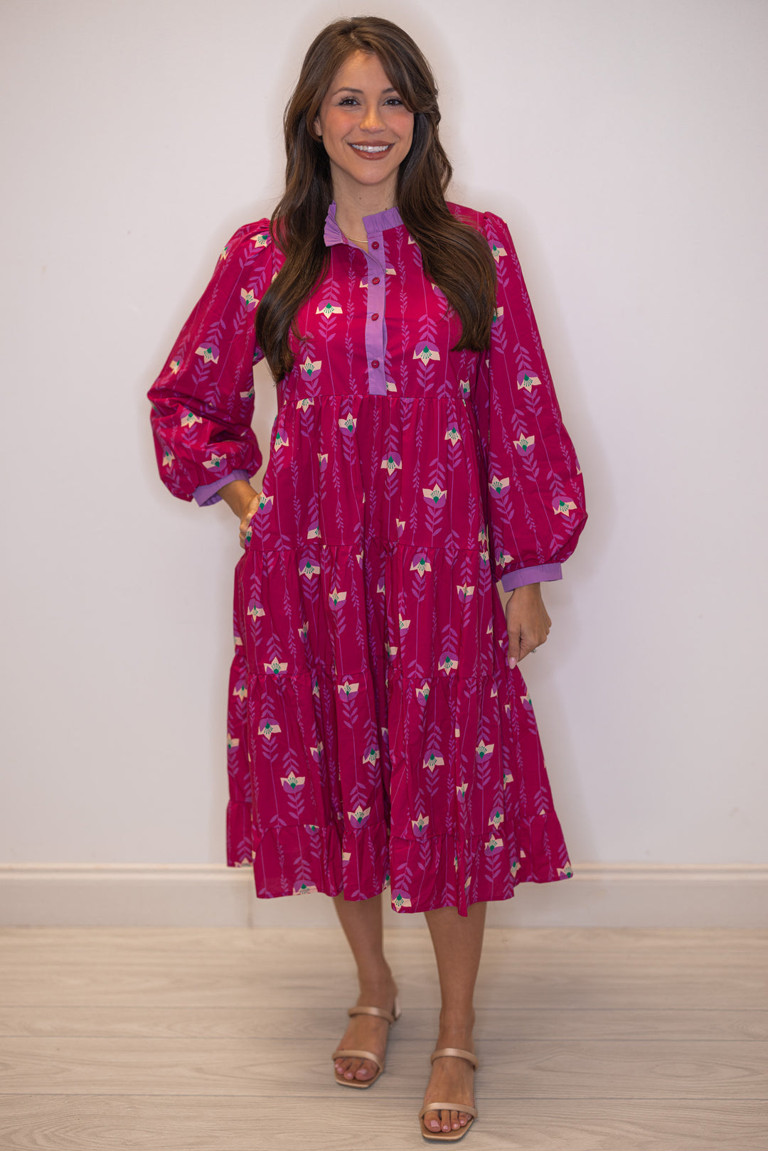 Women's magenta pink floral print tiered midi dress with button front bodice by Jodifl showing side pockets