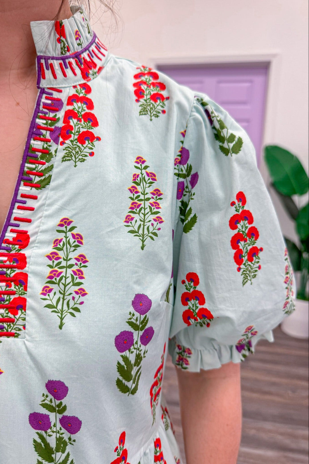 Women's light mint poplin dress showing trendy purple and red florals pattern