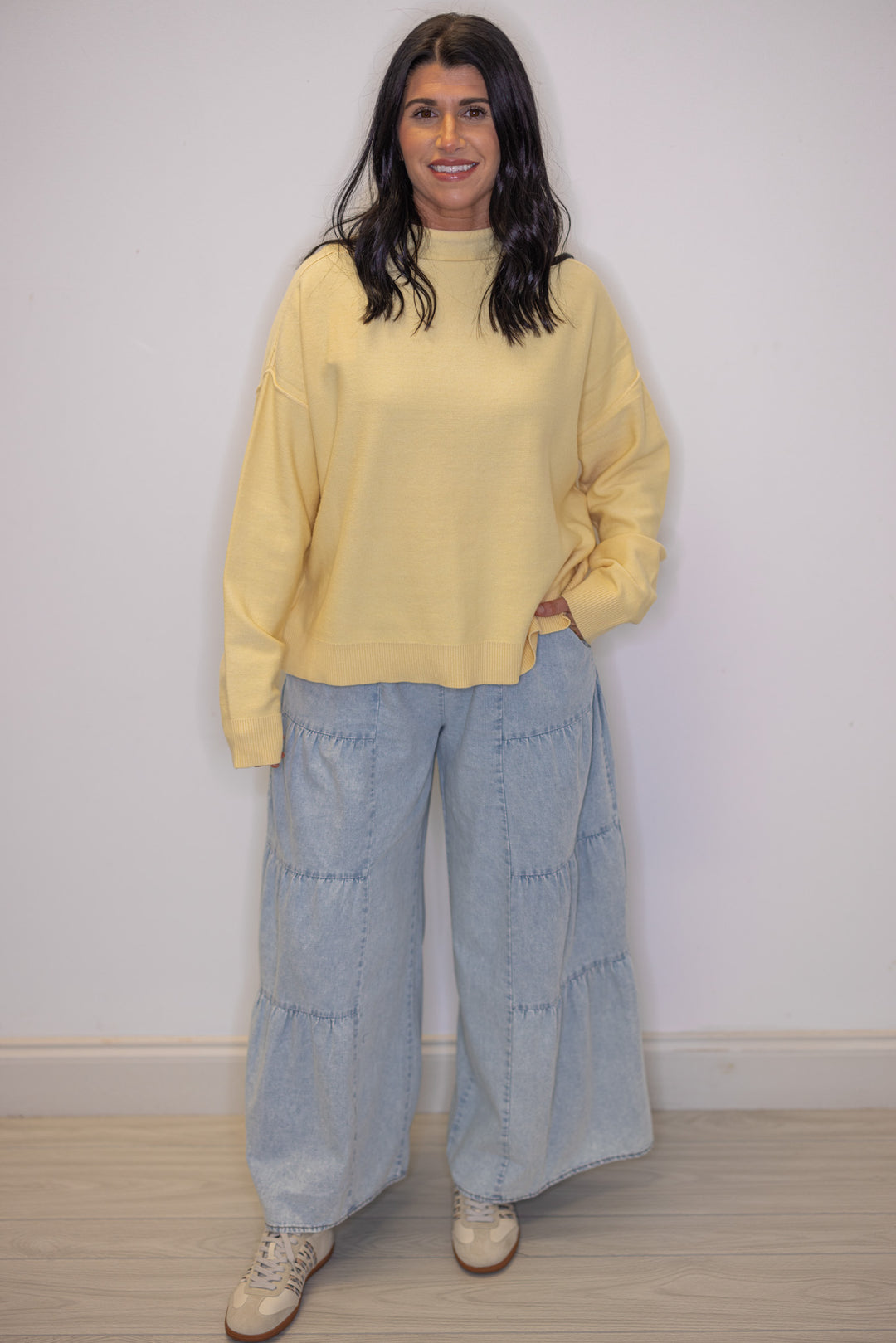 Women's light blue washed chambray denim wide leg pants with tiered detail, great for Spring transitional outfits