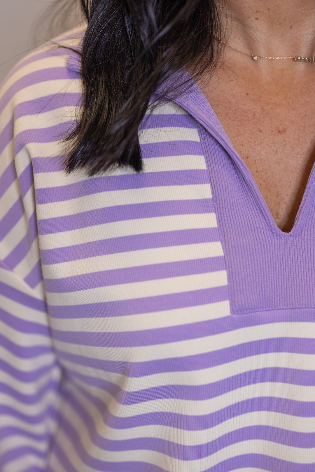 Women's ribbed knit top in lavender and cream stripes by Entro showing v neckline