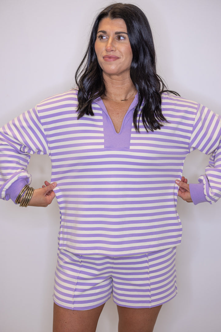 Women's ribbed knit top in lavender and cream stripes by Entro showing true to size fit
