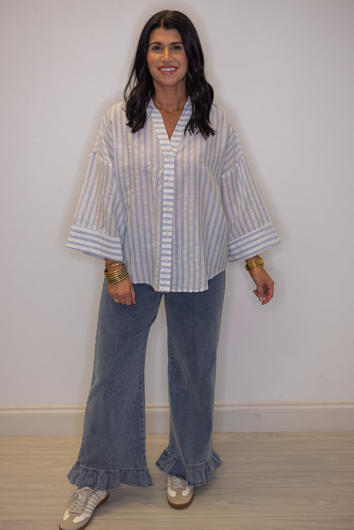 Women's light blue and cream striped button down top, perfect for teachers