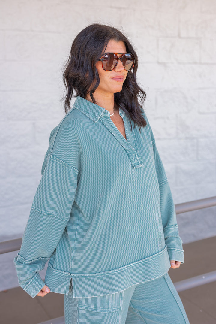 Women's washed teal ribbed knit top by Easel showing side view