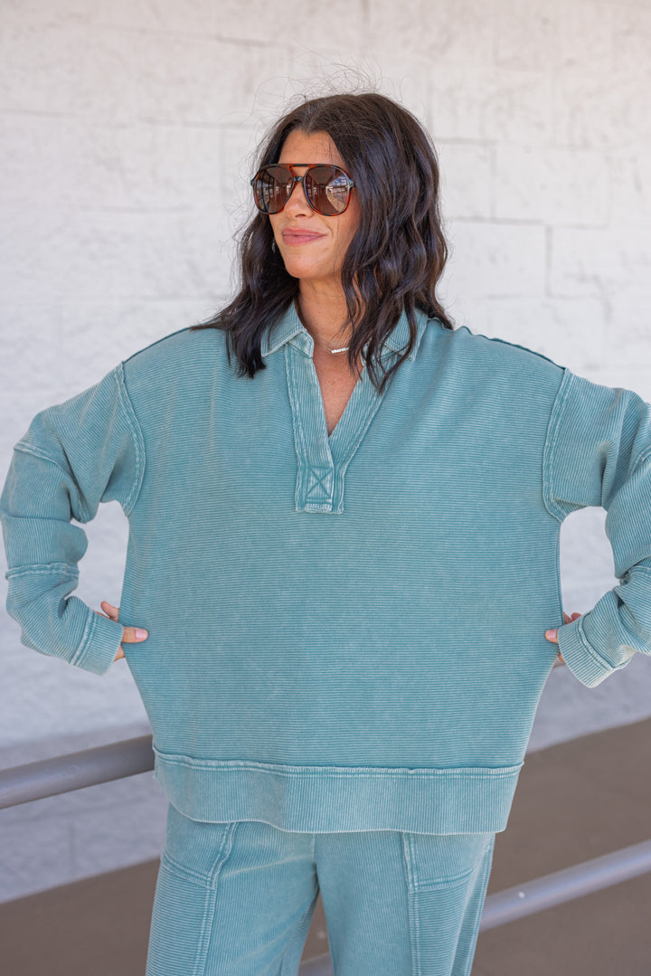 Women's washed teal ribbed knit top by Easel showing loose releaxed fit