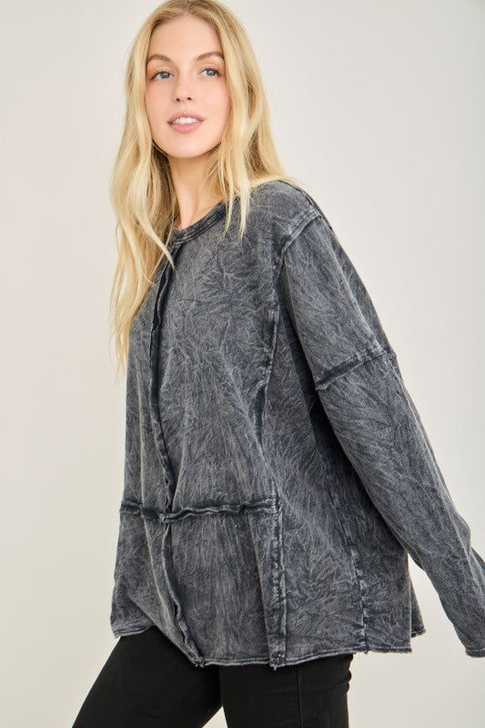 Women's mineral washed black top with raw edge square details by j.her showing side view