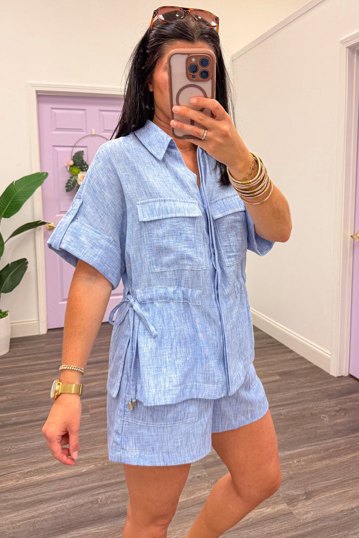 washed blue chambray cinch waist chest pockets cuffed short sleeve top